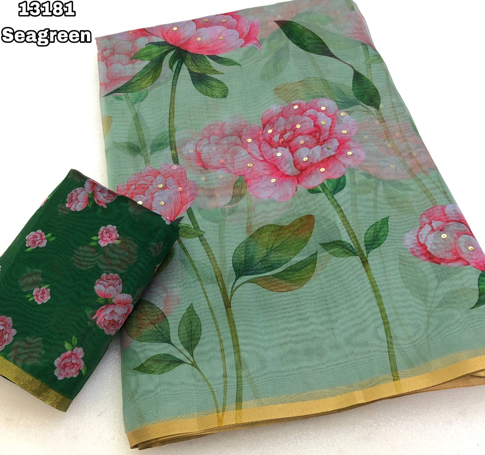 Mint Green Organza Saree with Pink Floral Digital Print and Gold Zari Border.